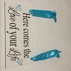 Double sided wedding sign with turquoise ribbon.